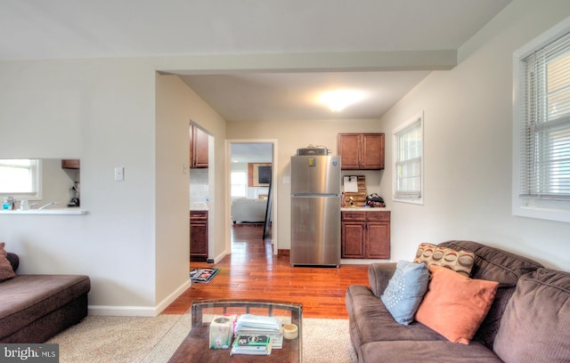 24 Edgewater Ln, Willingboro, NJ 08046 - living area featuring healthy amount of natural light, light wood-style flooring, and baseboards