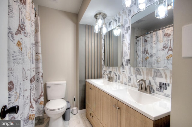 24 Edgewater Ln, Willingboro, NJ 08046 - full bath with toilet, double vanity, and baseboards