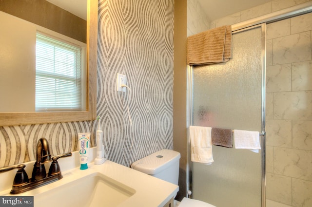 24 Edgewater Ln, Willingboro, NJ 08046 - bathroom featuring a stall shower, vanity, toilet, and wallpapered walls