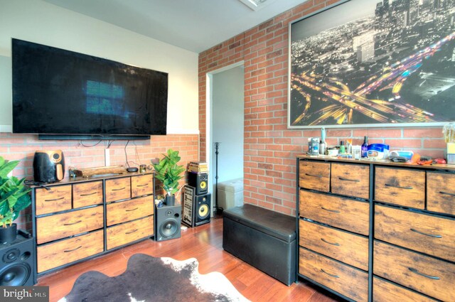 24 Edgewater Ln, Willingboro, NJ 08046 - living room with light wood-type flooring and brick wall