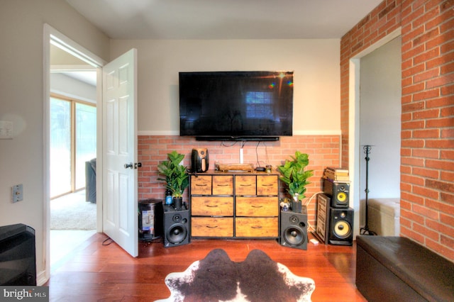 24 Edgewater Ln, Willingboro, NJ 08046 - living room featuring wood finished floors and brick wall