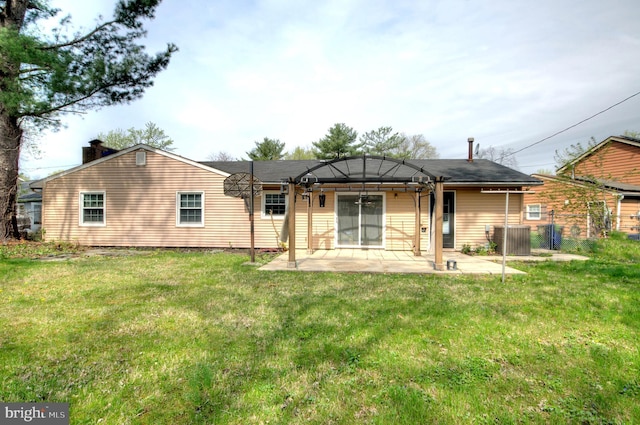 24 Edgewater Ln, Willingboro, NJ 08046 - rear view of property with a patio, central AC unit, a chimney, and a lawn