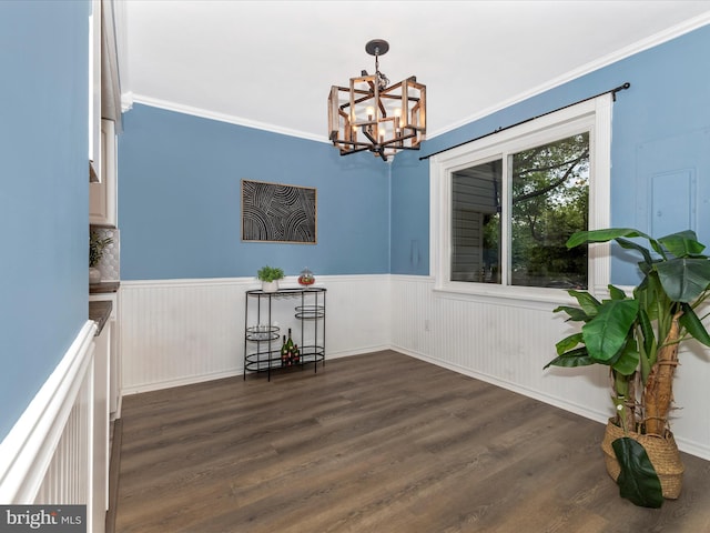8822 Stauffer Rd, Walkersville, MD 21793 - dining area featuring a chandelier, dark wood-style flooring, ornamental molding, and wainscoting