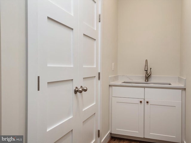 827 Janice Dr, Annapolis, MD 21403 - washroom featuring a sink and dark wood-style flooring