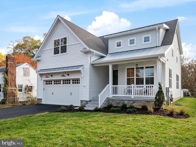 827 Janice Dr, Annapolis, MD 21403 - view of front of house with covered porch, a standing seam roof, a garage, a front lawn, and metal roof
