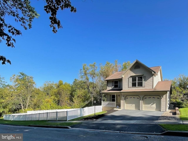 576 Kelker St, Oberlin, PA 17113 - traditional home featuring a garage, fence, and driveway