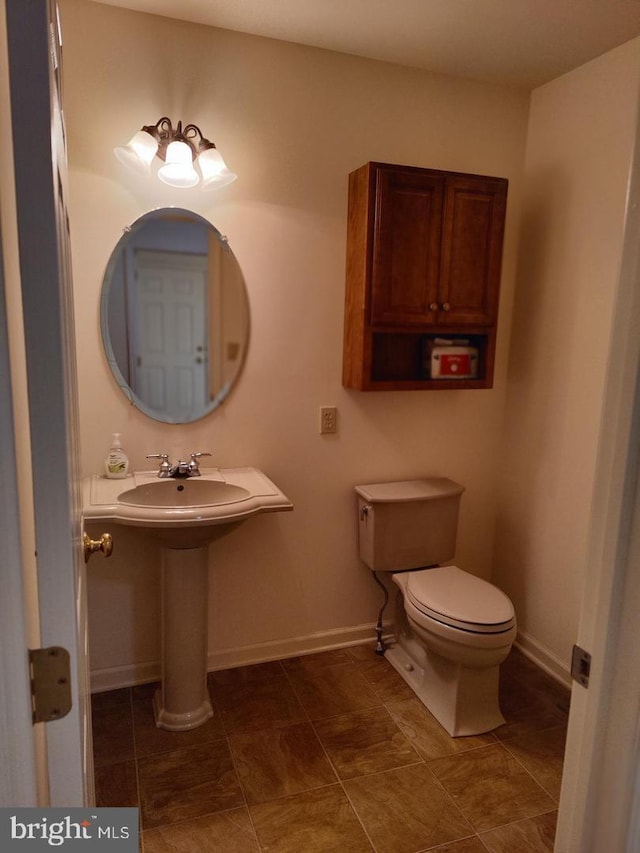 576 Kelker St, Oberlin, PA 17113 - half bath featuring toilet and baseboards