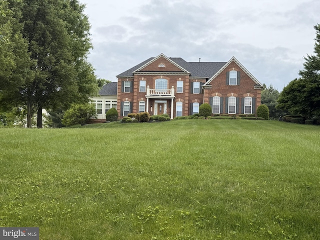 12810 Macbeth Farm Ln, Clarksville, MD 21029 - rear view of property featuring brick siding and a lawn