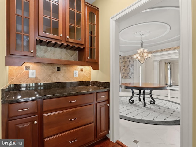 12810 Macbeth Farm Ln, Clarksville, MD 21029 - kitchen featuring glass insert cabinets, a chandelier, and dark stone counters