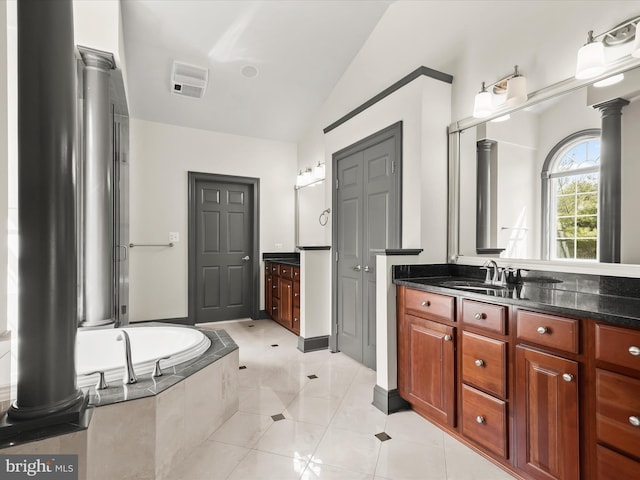 12810 Macbeth Farm Ln, Clarksville, MD 21029 - bathroom with ornate columns, vaulted ceiling, vanity, a closet, and tiled bath