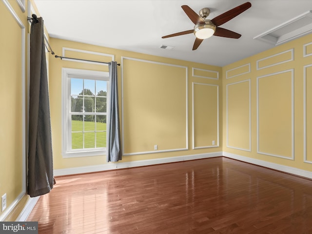 12810 Macbeth Farm Ln, Clarksville, MD 21029 - unfurnished room featuring a decorative wall, wood finished floors, baseboards, attic access, and ceiling fan