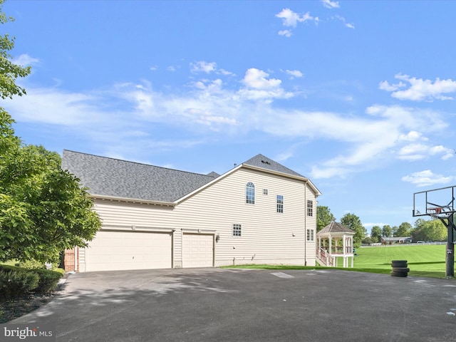 12810 Macbeth Farm Ln, Clarksville, MD 21029 - view of property exterior featuring driveway, roof with shingles, a gazebo, and a lawn