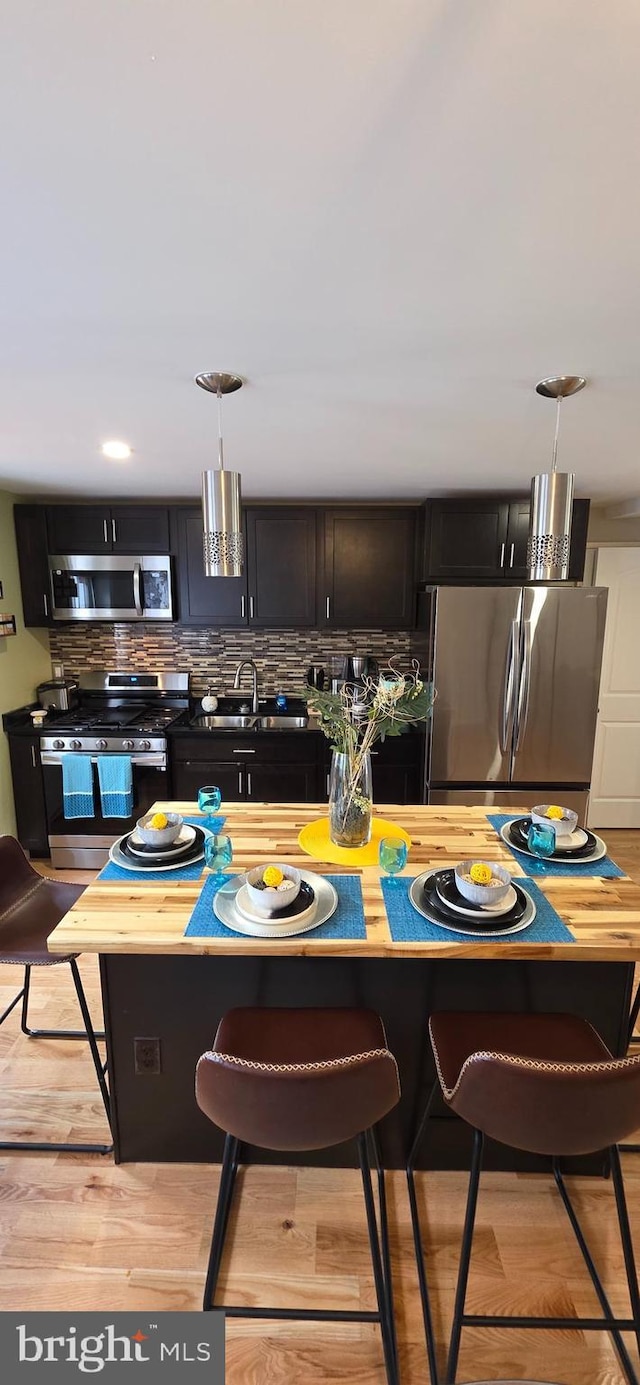 dining space featuring light wood-style flooring