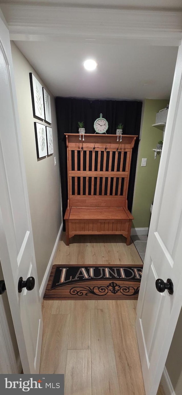 interior space featuring wood finished floors and baseboards