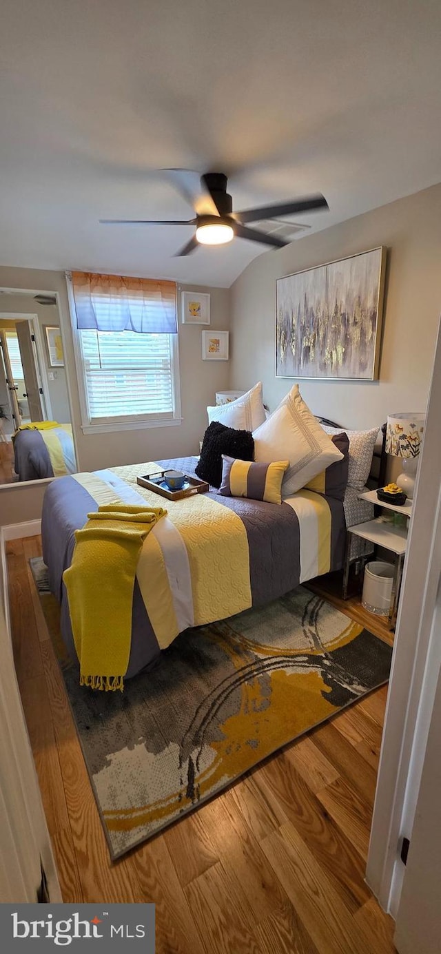 bedroom with wood finished floors and ceiling fan