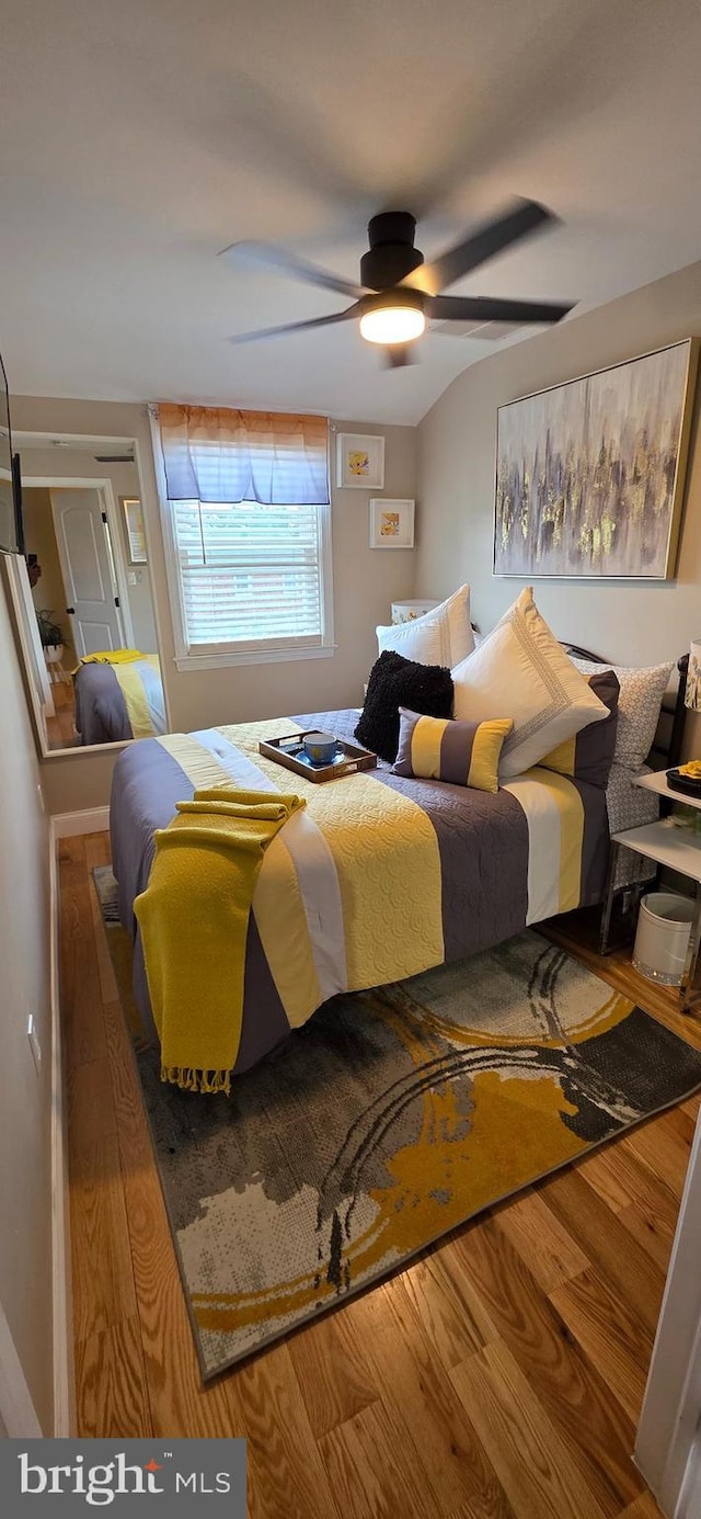 bedroom with wood finished floors and ceiling fan