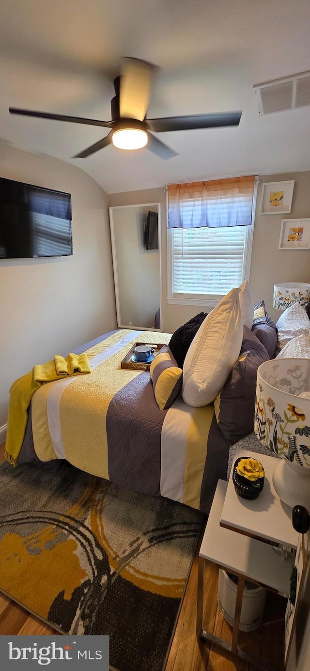 bedroom featuring ceiling fan and wood finished floors