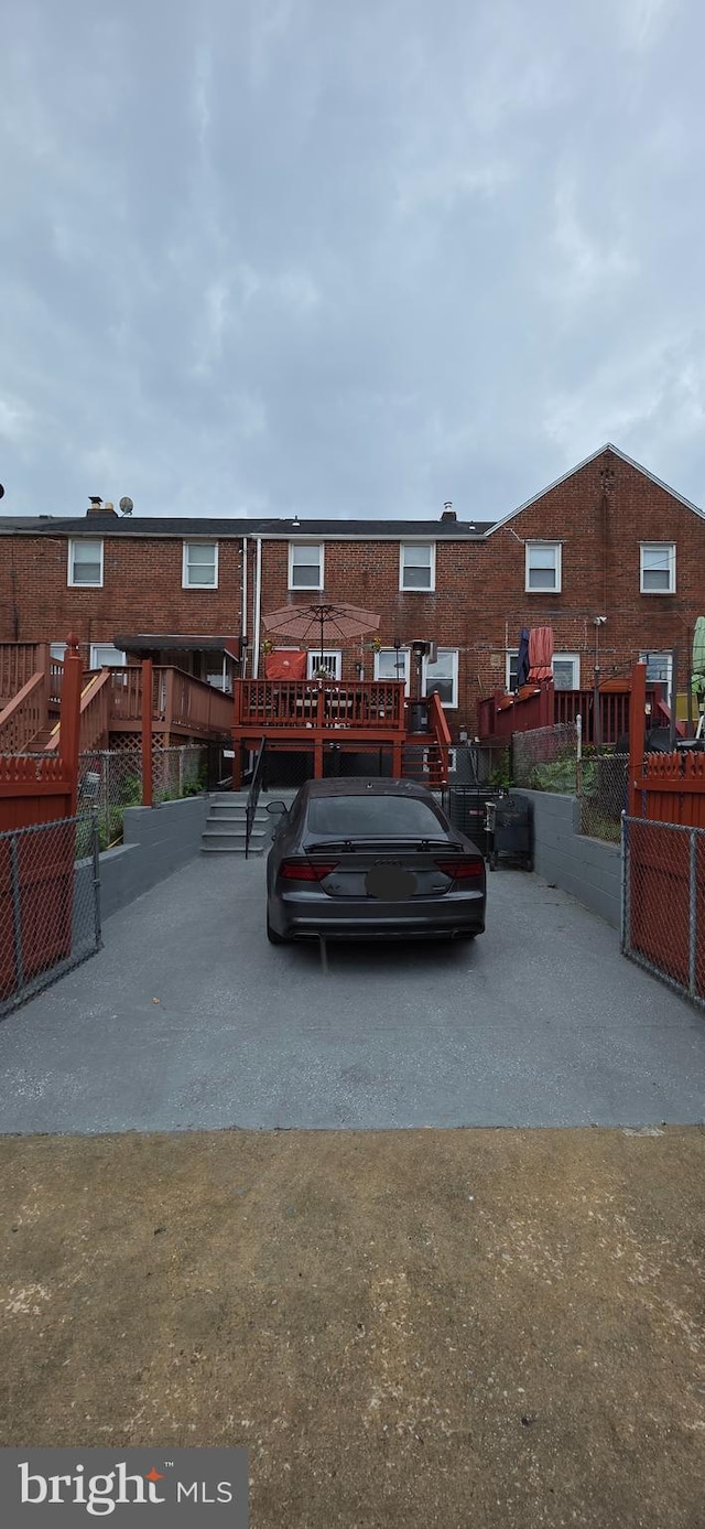 view of parking / parking lot featuring stairway