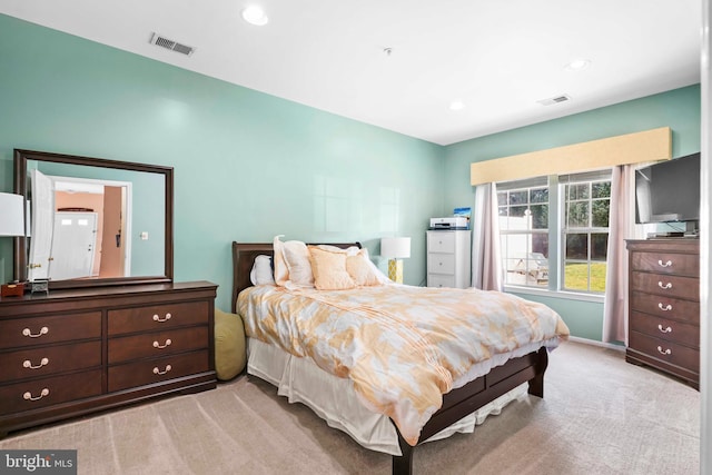 bedroom featuring light colored carpet and recessed lighting