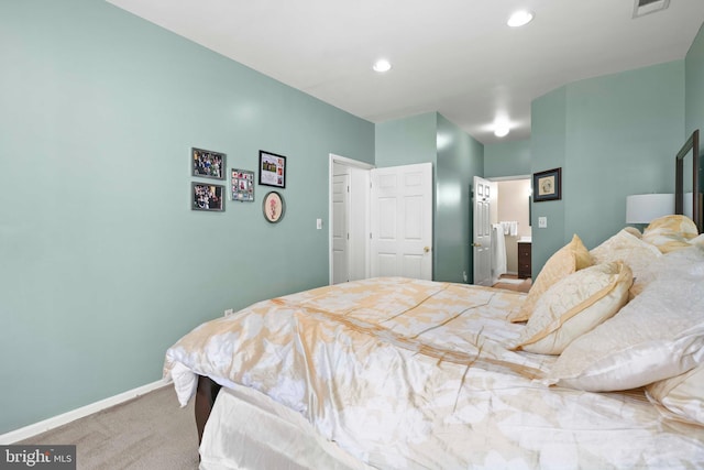 carpeted bedroom featuring baseboards and recessed lighting