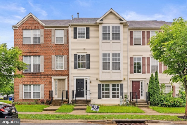9711 Luguna Rd, Baltimore, MD 21220 - townhome / multi-family property with brick siding
