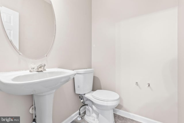 9711 Luguna Rd, Baltimore, MD 21220 - bathroom featuring baseboards and toilet