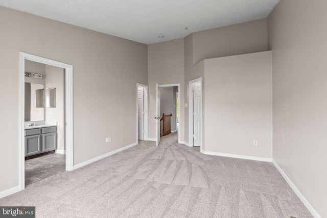 9711 Luguna Rd, Baltimore, MD 21220 - unfurnished bedroom with carpet floors, baseboards, and ensuite bath