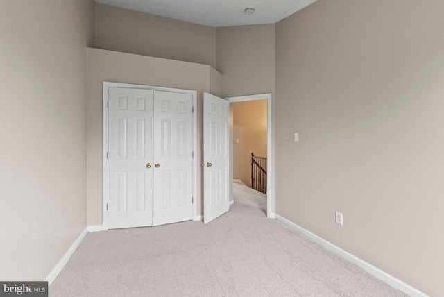9711 Luguna Rd, Baltimore, MD 21220 - unfurnished bedroom with carpet flooring, a closet, and baseboards