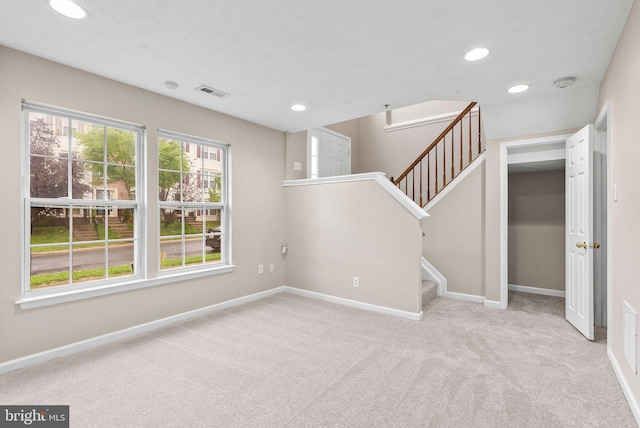9711 Luguna Rd, Baltimore, MD 21220 - unfurnished living room featuring recessed lighting, carpet flooring, baseboards, and stairs