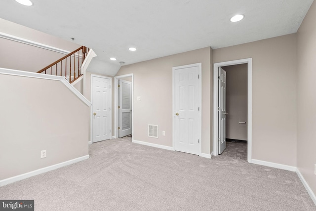 9711 Luguna Rd, Baltimore, MD 21220 - unfurnished living room featuring recessed lighting, carpet flooring, baseboards, and stairs