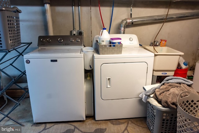 laundry room featuring washing machine and clothes dryer