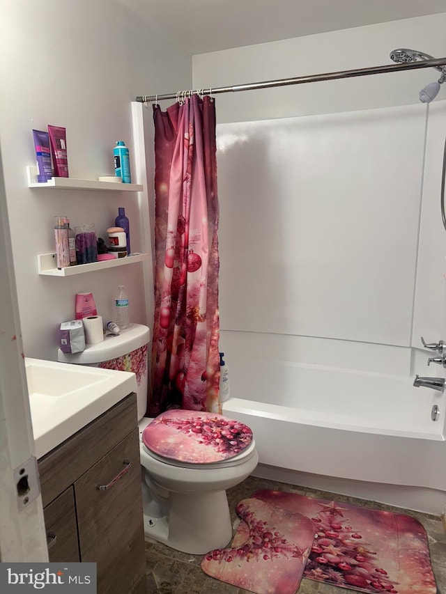 bathroom with shower / tub combo with curtain, toilet, and vanity