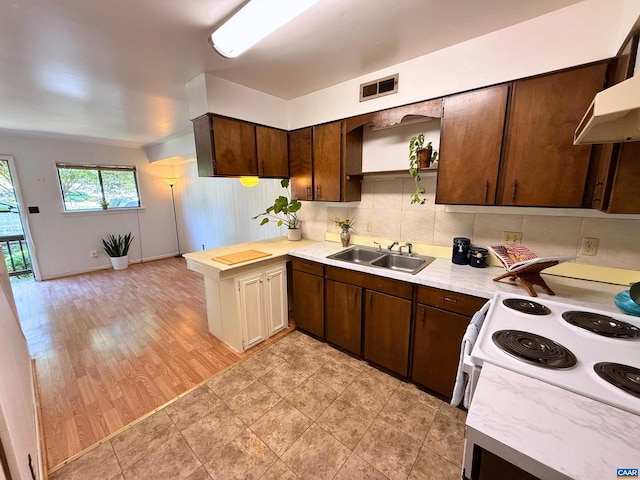 2100 Jefferson Park Ave Unit 4, Charlottesville, VA 22903 - kitchen with a sink, white electric stove, open shelves, light countertops, and dark brown cabinets