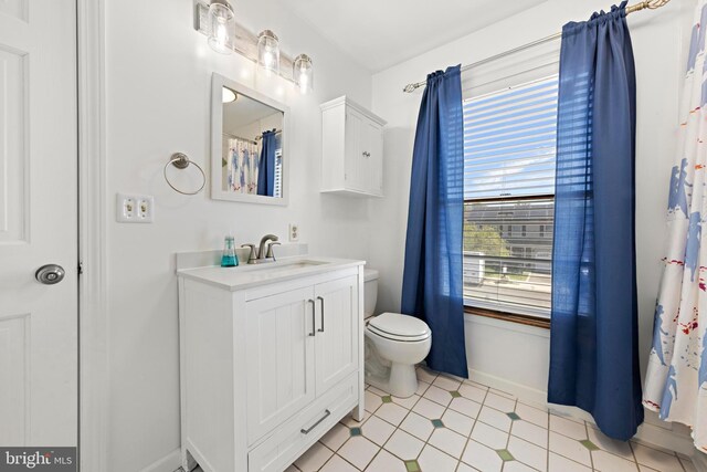 115 Holly Ct, Tuckerton, NJ 08087 - bathroom with toilet, vanity, and baseboards