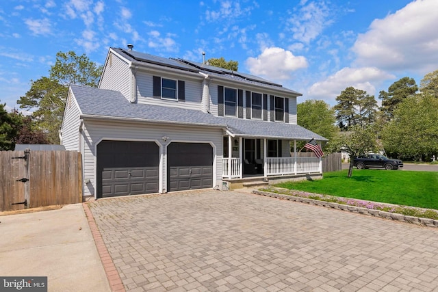 115 Holly Ct, Tuckerton, NJ 08087 - traditional home with a porch, decorative driveway, and solar panels