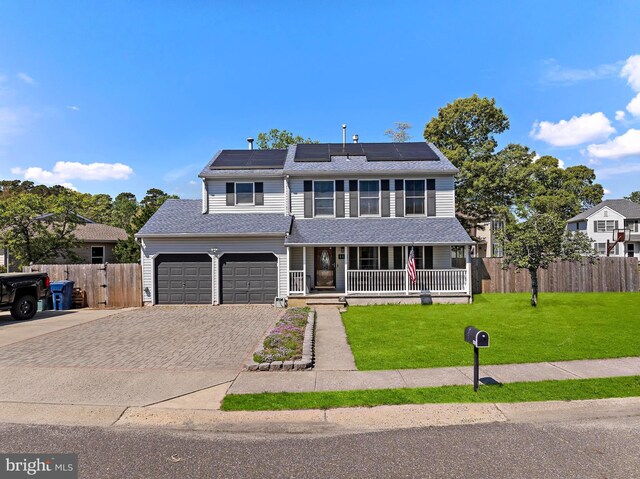 115 Holly Ct, Tuckerton, NJ 08087 - view of front of house with covered porch, decorative driveway, solar panels, and roof with shingles