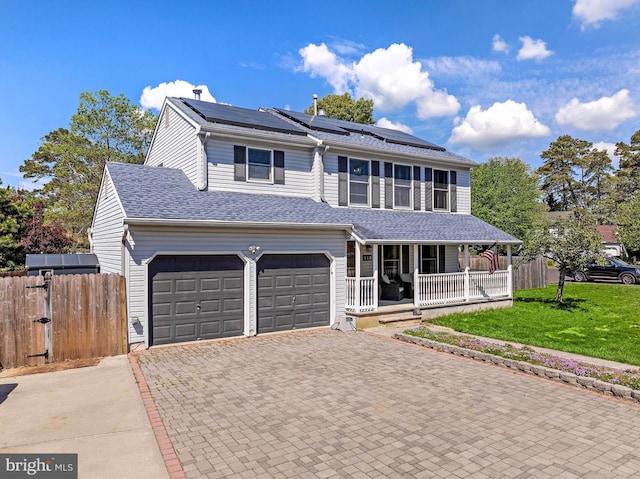 115 Holly Ct, Tuckerton, NJ 08087 - view of front of property with a porch, an attached garage, decorative driveway, and roof mounted solar panels