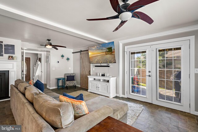115 Holly Ct, Tuckerton, NJ 08087 - living room featuring a ceiling fan, a barn door, stone tile flooring, french doors, and baseboards