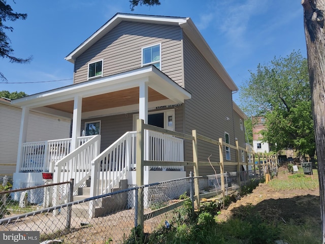 4620 Hunt Pl NE, Washington, DC 20019 - view of front of property with fence, covered porch, and cooling unit
