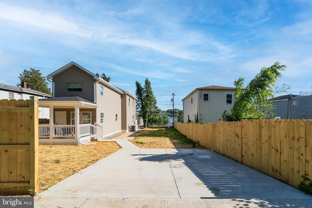4620 Hunt Pl NE, Washington, DC 20019 - view of home's exterior featuring a porch, fence, and central AC unit