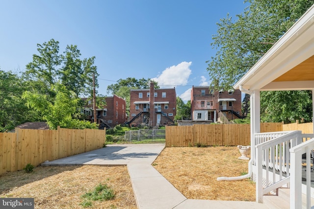 4620 Hunt Pl NE, Washington, DC 20019 - view of yard featuring fence, a residential view, and a patio