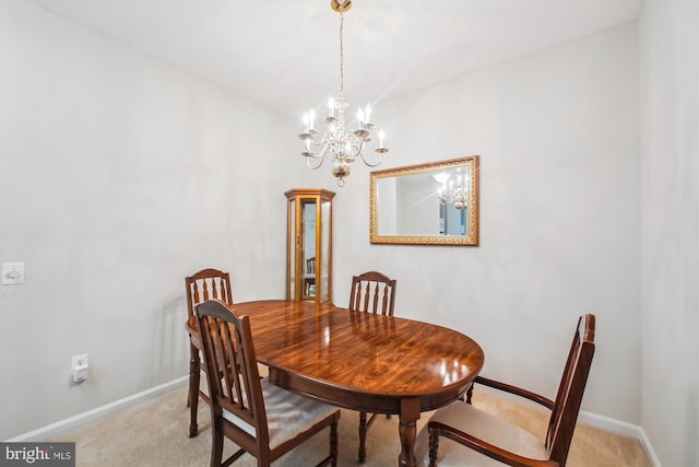 2604 Chapel Lake Dr Unit 107, Gambrills, MD 21054 - dining room featuring light carpet, baseboards, and a chandelier