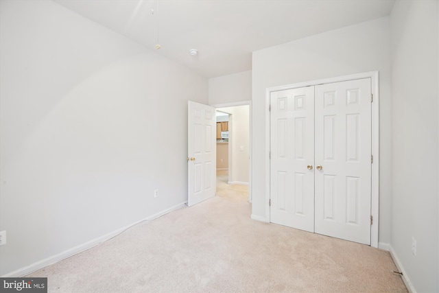 2604 Chapel Lake Dr Unit 107, Gambrills, MD 21054 - unfurnished bedroom with light carpet, a closet, and baseboards