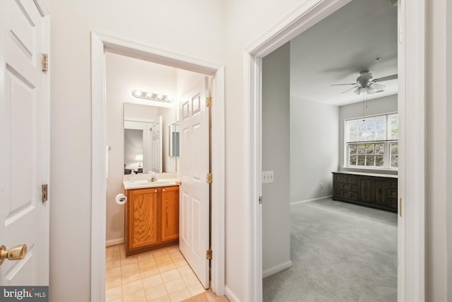 2604 Chapel Lake Dr Unit 107, Gambrills, MD 21054 - hall with a sink, baseboards, and light carpet