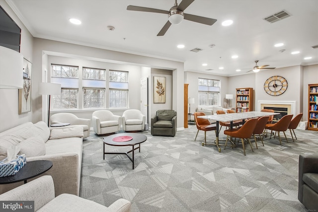 2604 Chapel Lake Dr Unit 107, Gambrills, MD 21054 - living area featuring ceiling fan, light colored carpet, recessed lighting, a glass covered fireplace, and ornamental molding