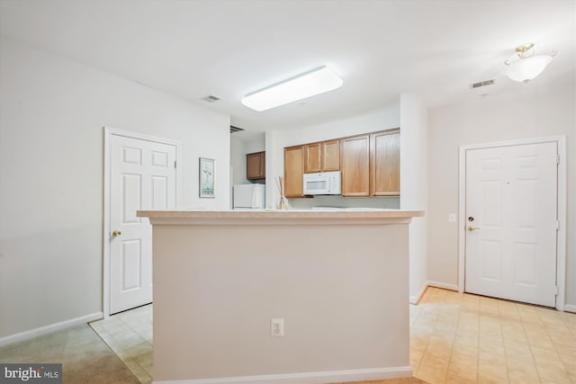 2604 Chapel Lake Dr Unit 107, Gambrills, MD 21054 - kitchen featuring white appliances, baseboards, and light countertops