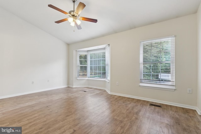 7879 Wintercress Ln, Springfield, VA 22152 - empty room with lofted ceiling, wood finished floors, a ceiling fan, and baseboards