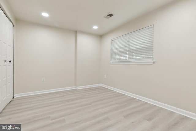 7879 Wintercress Ln, Springfield, VA 22152 - unfurnished bedroom with recessed lighting, light wood finished floors, baseboards, and a closet