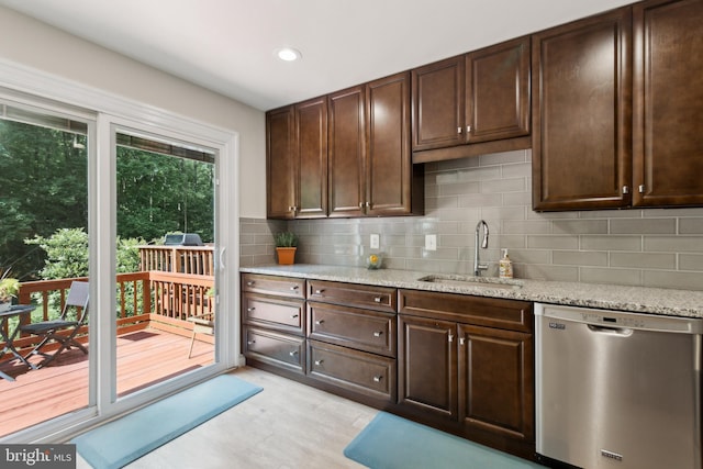 7879 Wintercress Ln, Springfield, VA 22152 - kitchen with dishwasher, a sink, backsplash, dark brown cabinetry, and recessed lighting