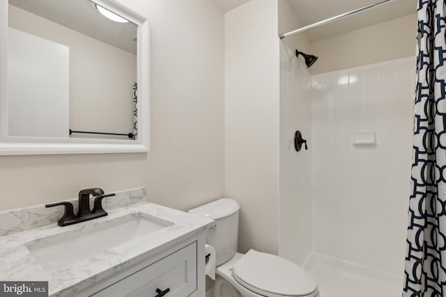 7879 Wintercress Ln, Springfield, VA 22152 - bathroom featuring vanity, toilet, and a tile shower